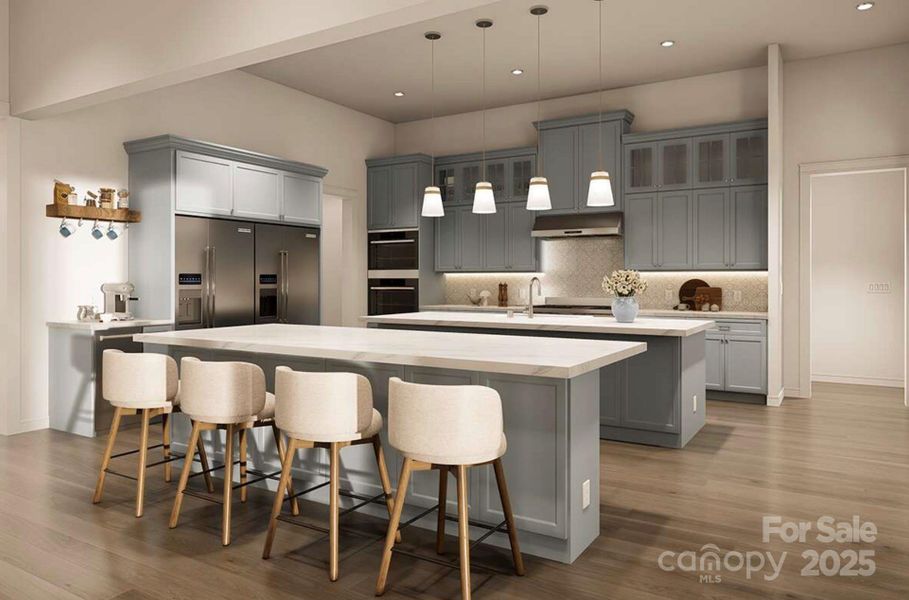 This gourmet kitchen is a perfect blend of style and functionality. It features soft blue-gray custom cabinetry, sleek quartz countertops, and a double island layout that offers ample space for meal prep and casual dining This gourmet kitchen is a perfect blend of style and functionality. It features soft blue-gray custom cabinetry, sleek quartz countertops, and a double island layout that offers ample space for meal prep and casual dining