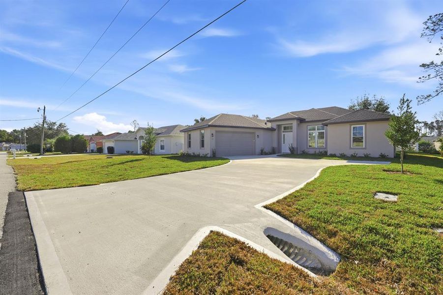 Front exterior of a new home in , Palm Coast, FL, highlighting curb appeal (Image 23).