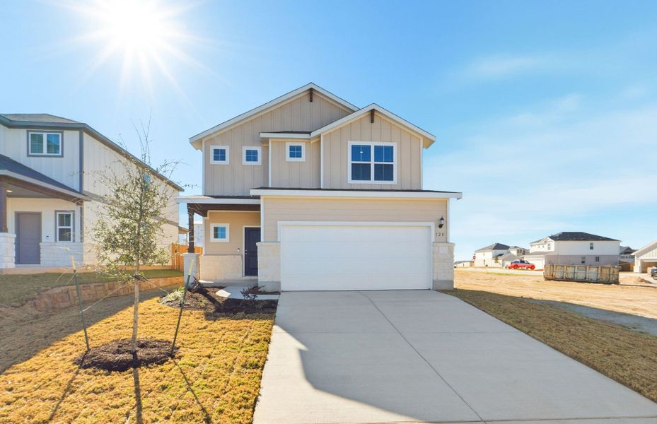Front exterior of a new home in Sunfield, Buda, TX, highlighting curb appeal (Image 20).