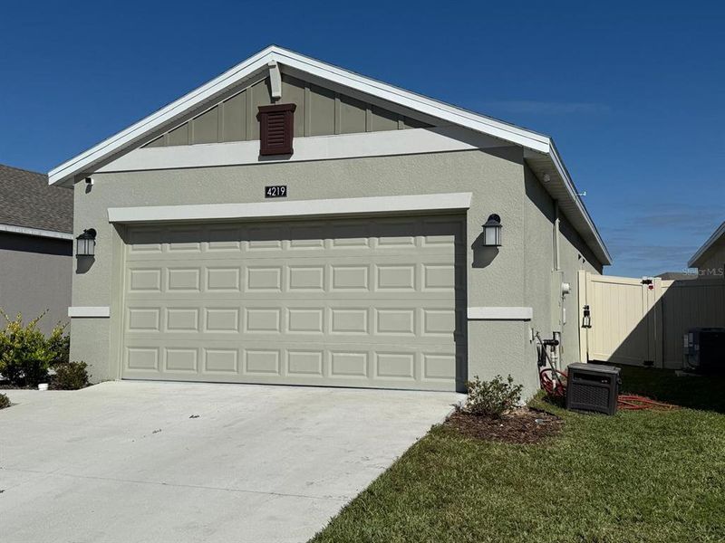Front exterior of a new home in , Kissimmee, FL, highlighting curb appeal (Image 23).