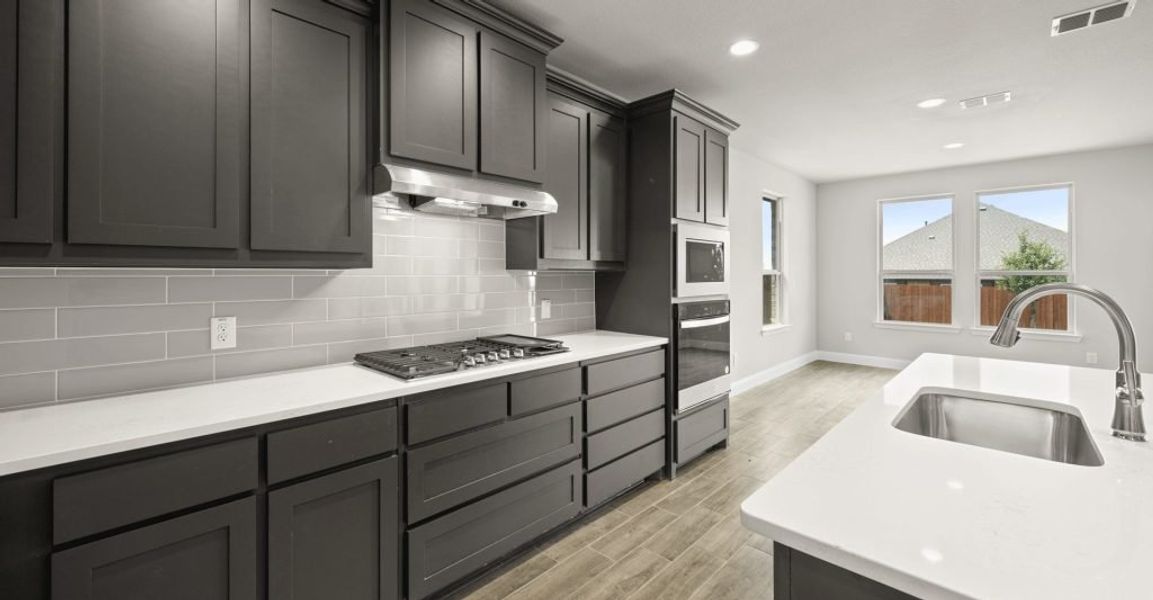 Representative exterior photo of a completed home built from the Donnington by Impression Homes in Still Water Lake, Godley, TX (Image 6).