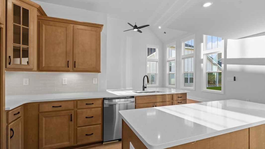 Accomplished kitchen layout with a compact island, perfect for prep and casual dining