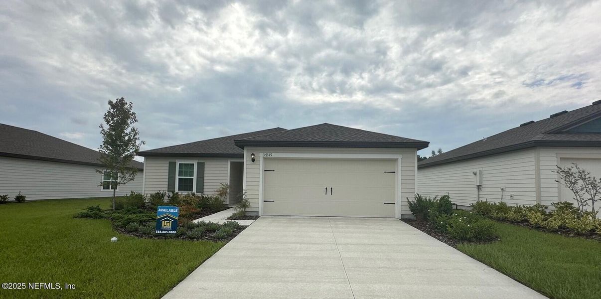 Front exterior of a new home in , Hilliard, FL, highlighting curb appeal (Image 2). Front exterior of a new home in , Hilliard, FL, highlighting curb appeal (Image 2).