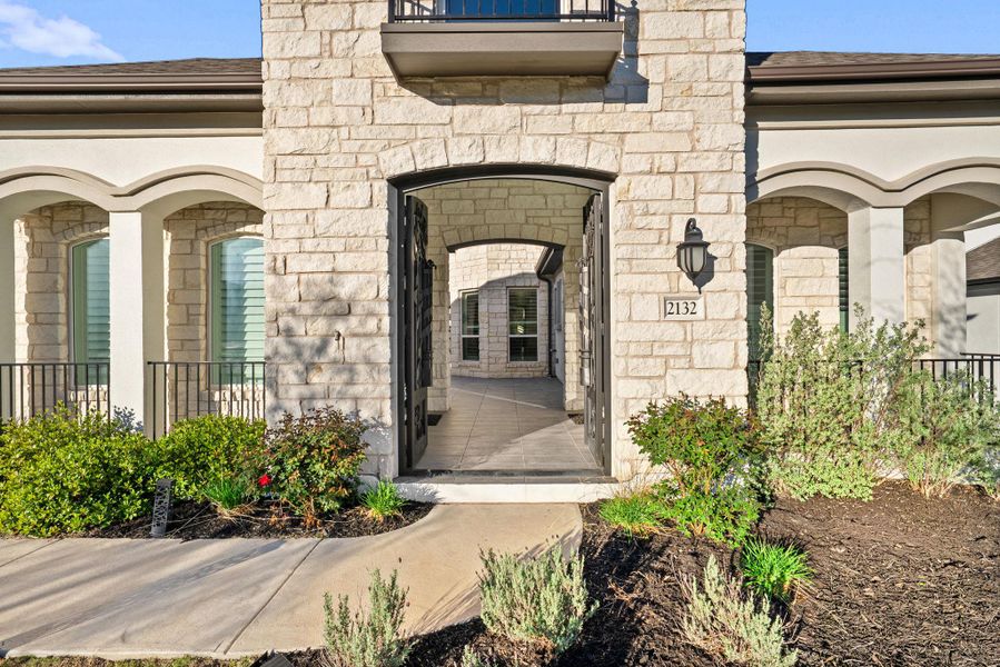 Doorway to property featuring stone siding