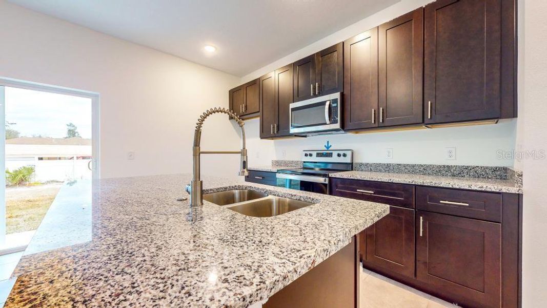 Furnished interior view inside a new home in , Dunnellon (Image 12).