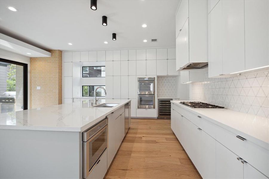 Impressive wall of kitchen cabinets.