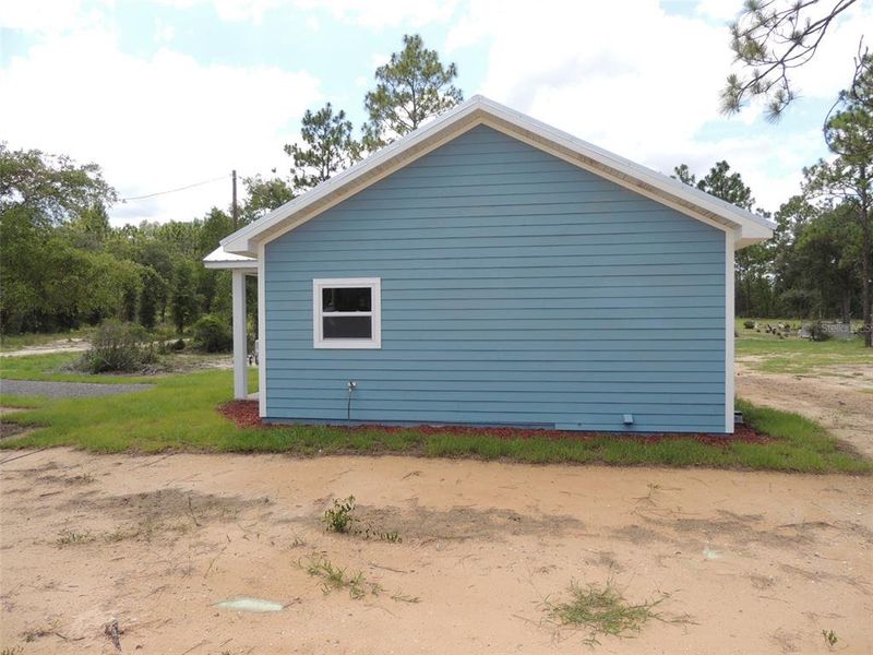 Exterior details and patio area of a home in , Williston (Image 18).