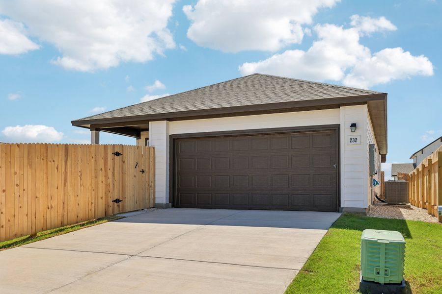 Front exterior of a new home in Sage Hollow, Kyle, TX, highlighting curb appeal (Image 15).