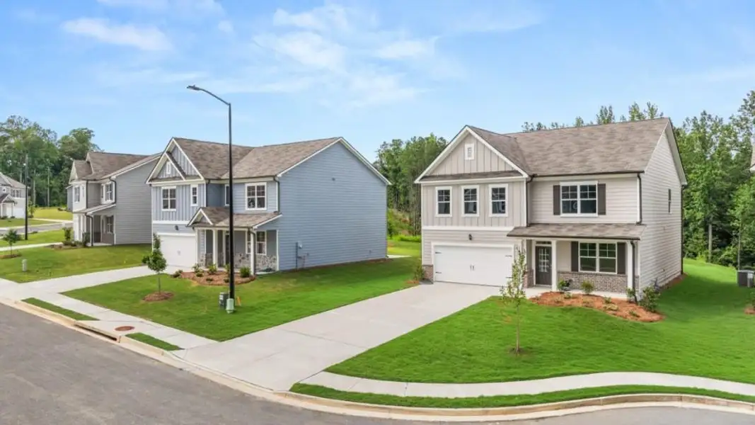 Front exterior of a new home in Lost Creek, Dallas, GA, highlighting curb appeal (Image 1). Front exterior of a new home in Lost Creek, Dallas, GA, highlighting curb appeal (Image 1).