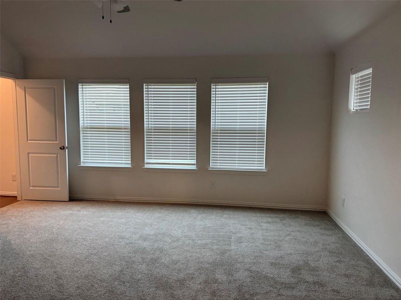 Private primary suite features plush carpet, large windows, and plenty of room for oversized furniture. Private primary suite features plush carpet, large windows, and plenty of room for oversized furniture.