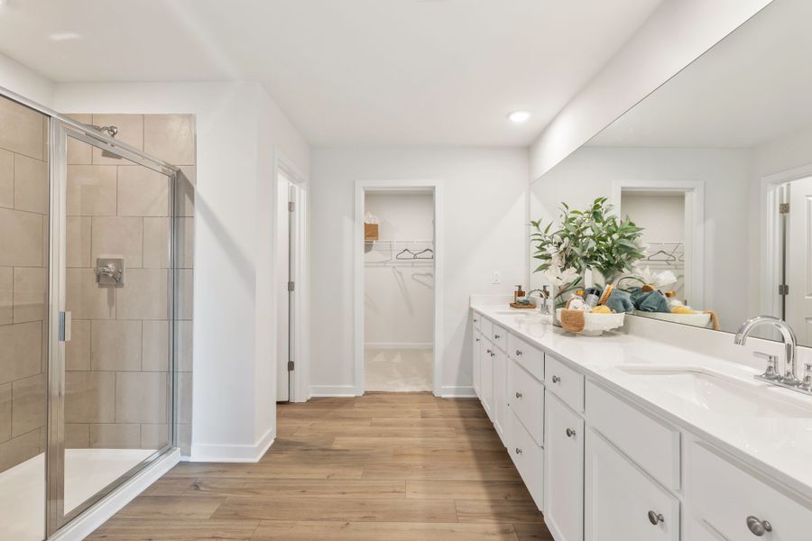 A bathroom with a glass shower. A bathroom with a glass shower.