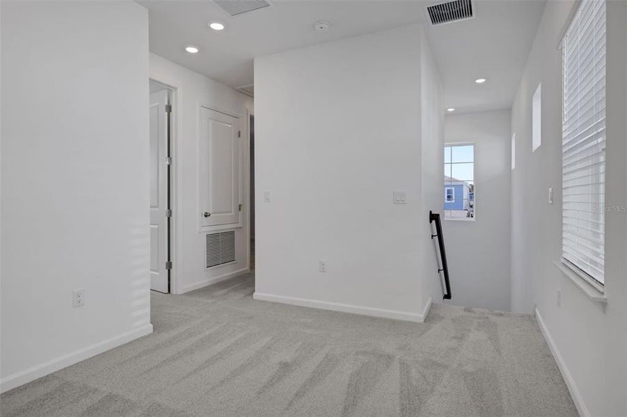 Spacious, unfurnished interior of a new home in Serenade at Ovation, Winter Garden (Image 21).