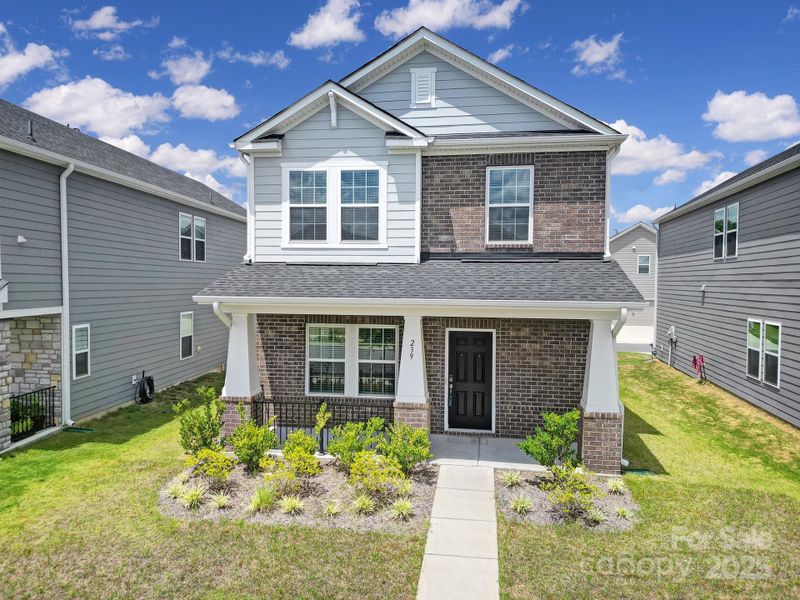 Front exterior of a new home in Preston Park, Pineville, NC, highlighting curb appeal (Image 2). Front exterior of a new home in Preston Park, Pineville, NC, highlighting curb appeal (Image 2).