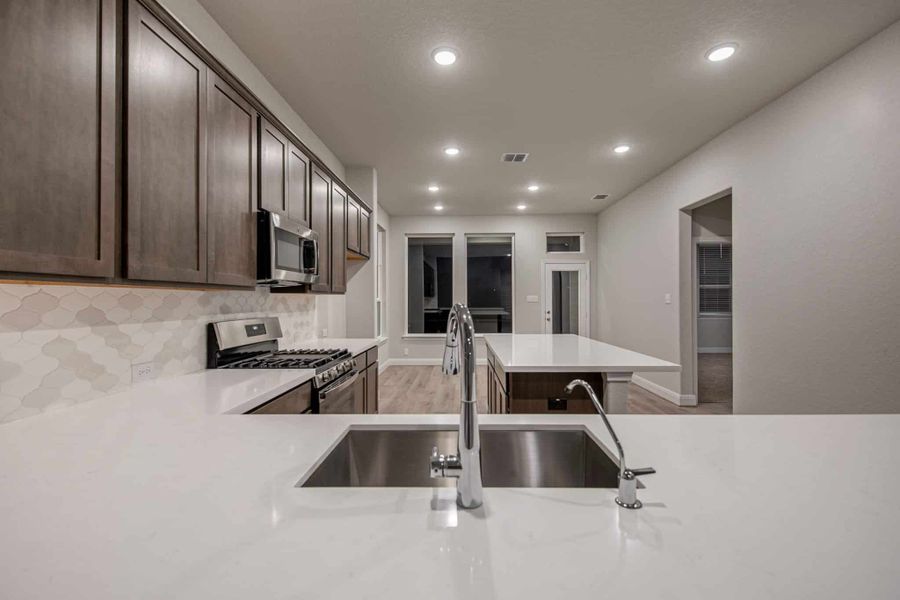 Representative furnished interior of a home built from the Portofino by Chesmar Homes in Legacy at Lake Dunlap, New Braunfels (Image 4). Representative furnished interior of a home built from the Portofino by Chesmar Homes in Legacy at Lake Dunlap, New Braunfels (Image 4).