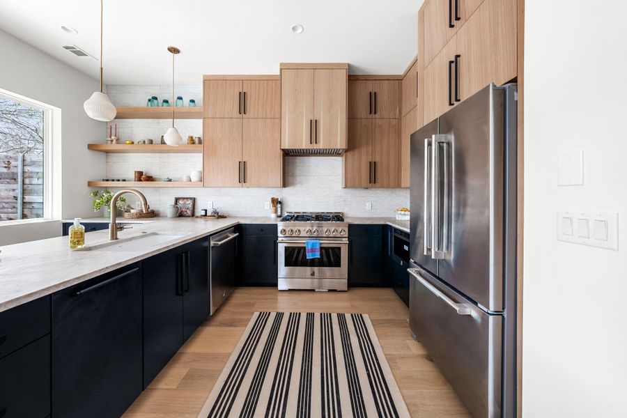 Stainless steel JennAir appliance package including fridge