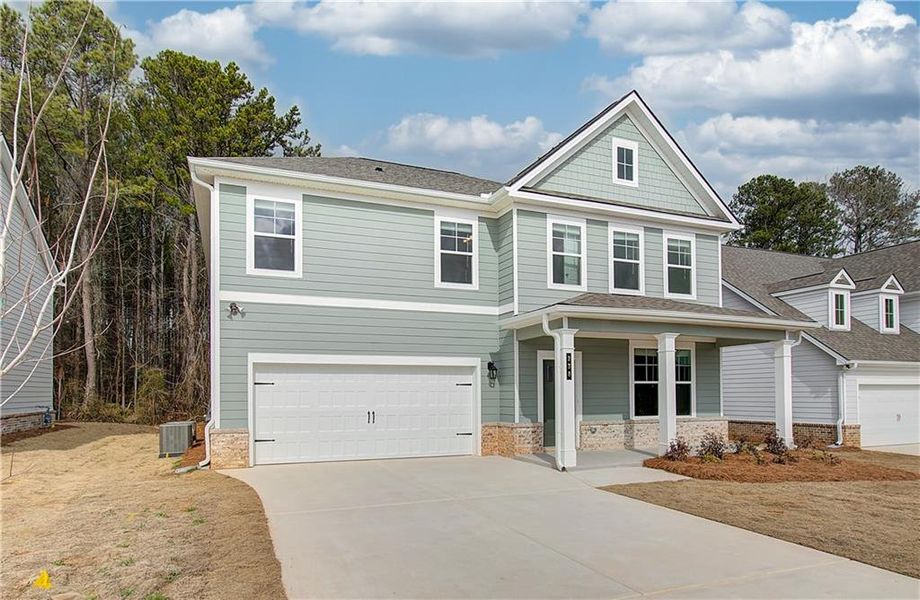 Front exterior of a new home in Cooper Park, McDonough, GA, highlighting curb appeal (Image 17).