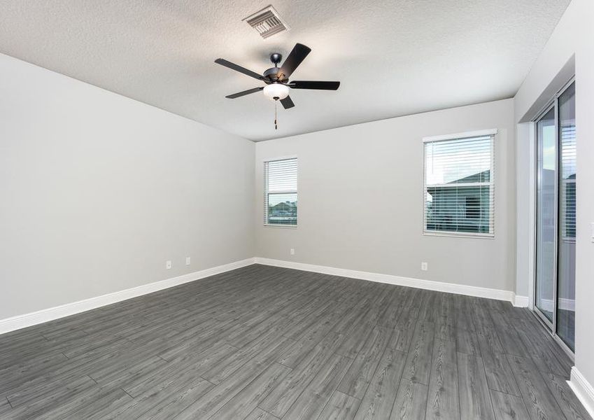 Two large windows bring in natural light to the family room