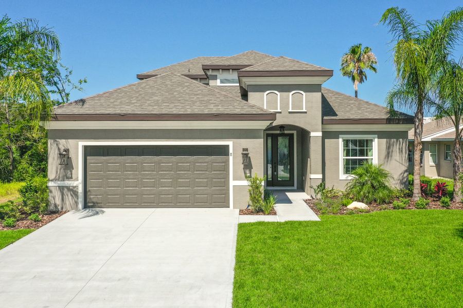 Representative exterior photo of a completed home built from the St. Andrews by SeaGate Homes in Tidelands, Palm Coast, FL (Image 22).