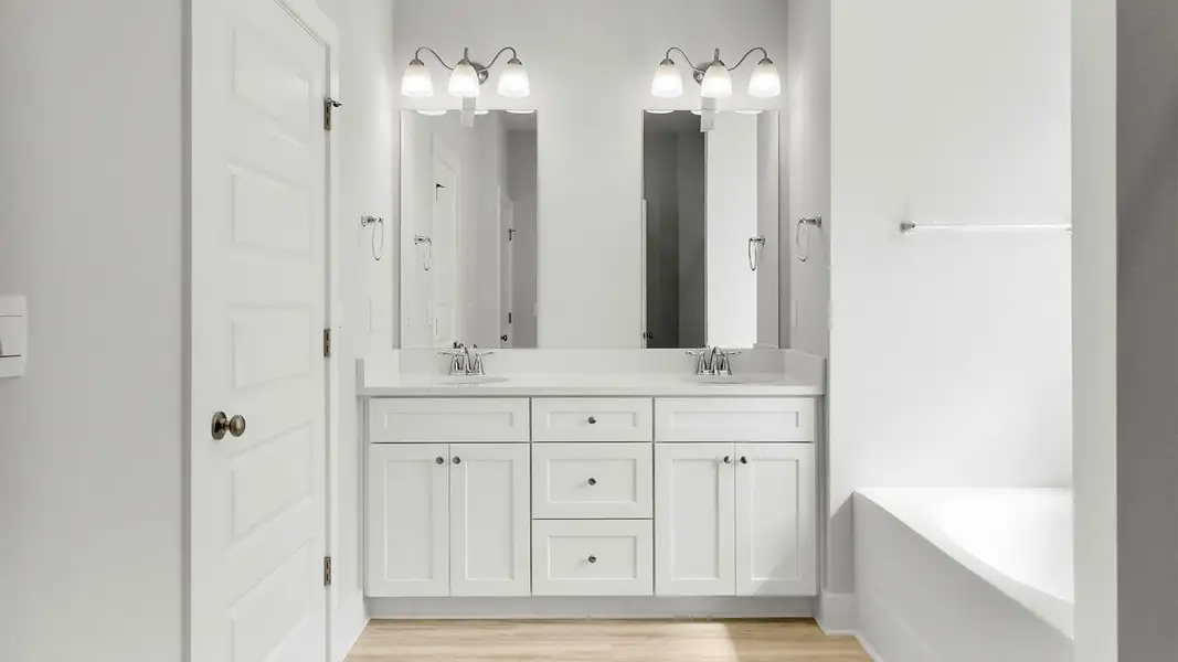 Representative furnished interior of a home built from the The Kennedy by D.R. Horton in Titus Park, Panama City (Image 10).