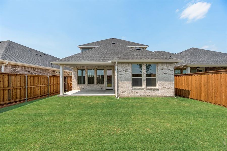 Front exterior of a new home in Spiritas Ranch, Little Elm, TX, highlighting curb appeal (Image 18). Front exterior of a new home in Spiritas Ranch, Little Elm, TX, highlighting curb appeal (Image 18).