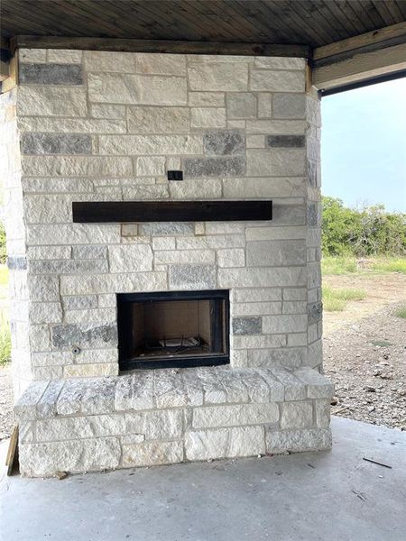 Back patio Wood Burning stone fireplace