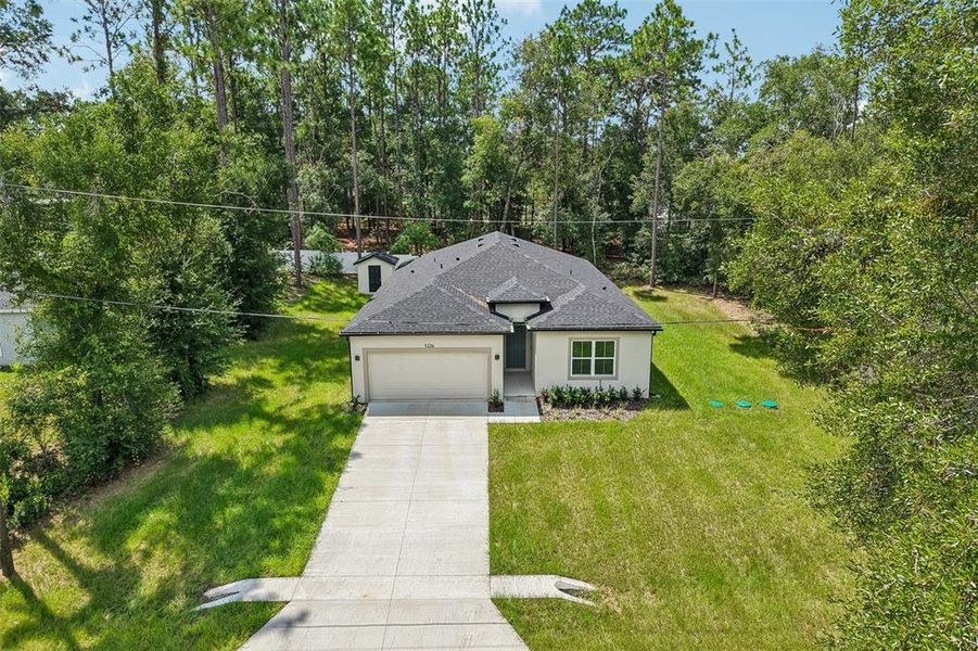 Front exterior of a new home in , Inverness, FL, highlighting curb appeal (Image 23).