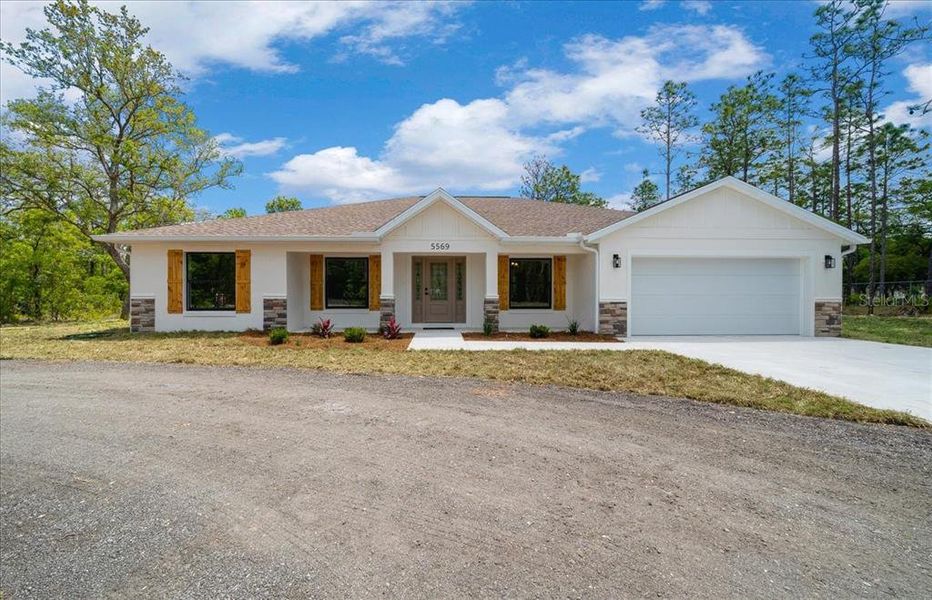 Front exterior of a new home in , Ocala, FL, highlighting curb appeal (Image 30).