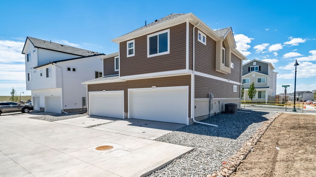 Front exterior of a new home in Banning Lewis Ranch, Colorado Springs, CO, highlighting curb appeal (Image 22).