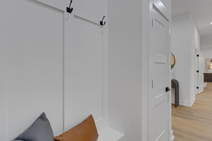 Convenient mudroom with built-in bench and hooks. The perfect space for organizing coats and bags. Convenient mudroom with built-in bench and hooks. The perfect space for organizing coats and bags.