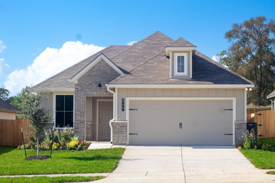 Front exterior of a new home in , Huntsville, TX, highlighting curb appeal (Image 1).