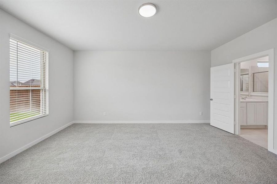 Primary Suite in the Masters home plan by Trophy Signature Homes – REPRESENTATIVE PHOTO