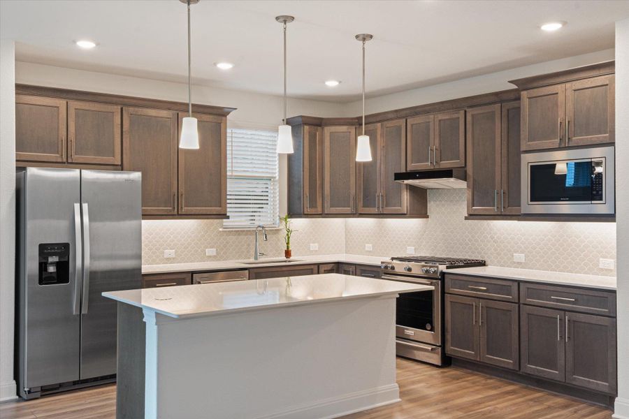 Kitchen has Roll-drawers in cabinets, Kitchen-Aid appliances