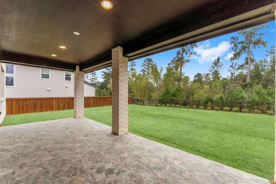 Exterior details and patio area of a home in , Magnolia (Image 3). Exterior details and patio area of a home in , Magnolia (Image 3).