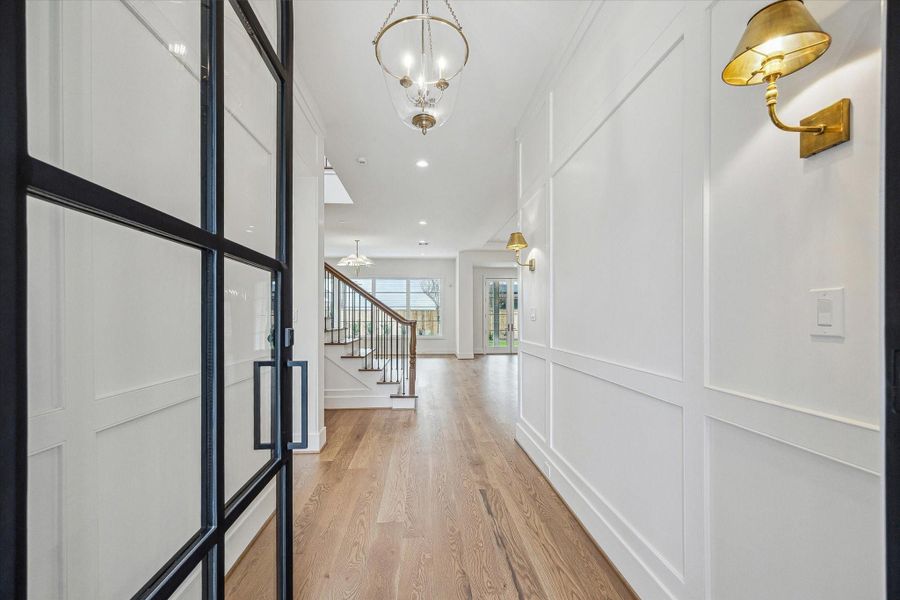 Oversized front door with custom paneled entrance and High End finishes! Expansive oak flooring leads to wonderful open floor plan! Oversized front door with custom paneled entrance and High End finishes! Expansive oak flooring leads to wonderful open floor plan!