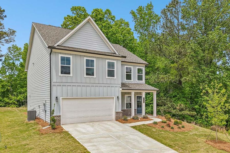 Front exterior of a new home in The Estates at Casteel, Bethlehem, GA, highlighting curb appeal (Image 2). Front exterior of a new home in The Estates at Casteel, Bethlehem, GA, highlighting curb appeal (Image 2).