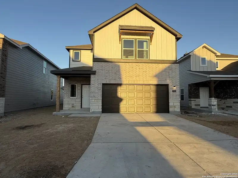 Front exterior of a new home in Meadows at Hennersby Hollow 40's, San Antonio, TX, highlighting curb appeal (Image 1). Front exterior of a new home in Meadows at Hennersby Hollow 40's, San Antonio, TX, highlighting curb appeal (Image 1).