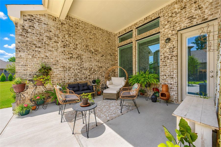 Step outside to a covered patio, perfect for relaxing and enjoying the outdoors year-round. Step outside to a covered patio, perfect for relaxing and enjoying the outdoors year-round.