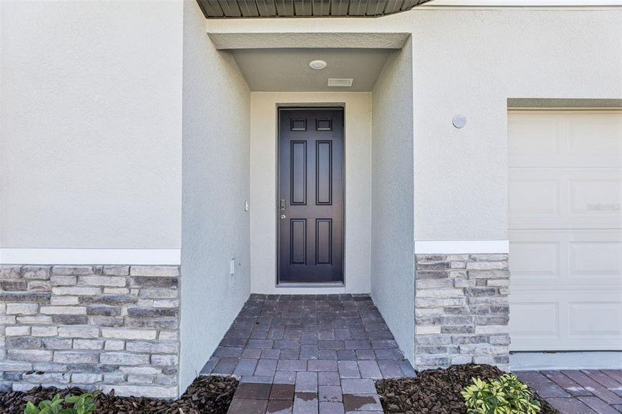 Exterior details and patio area of a home in Lake Deer Estates - Signature Series, Poinciana (Image 4).