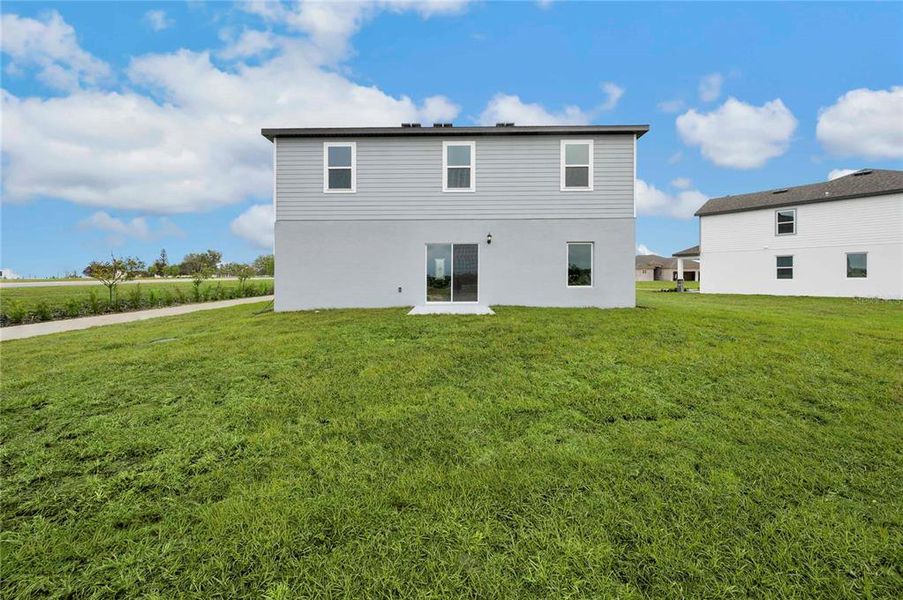 Exterior details and patio area of a home in Citrus Place, Babson Park (Image 4).