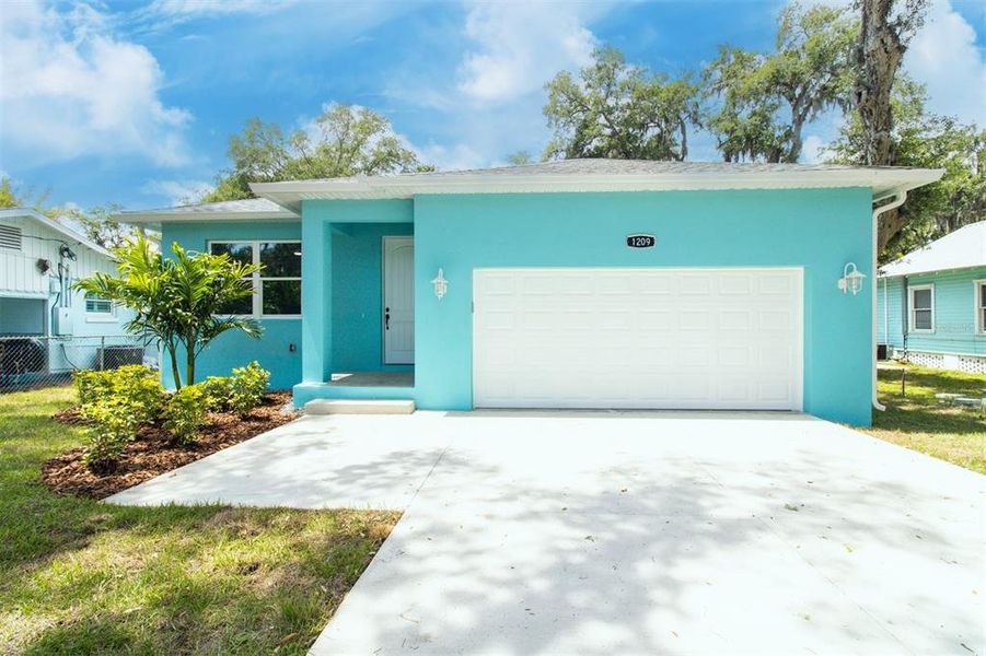 Front exterior of a new home in , New Smyrna Beach, FL, highlighting curb appeal (Image 14).