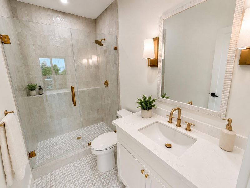 Guest bath#1 with marble for and countertop and large walk in glass shower