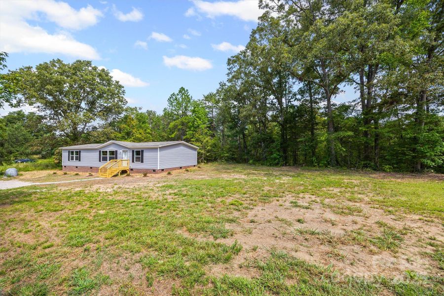 Front exterior of a new home in , Sharon, SC, highlighting curb appeal (Image 1). Front exterior of a new home in , Sharon, SC, highlighting curb appeal (Image 1).
