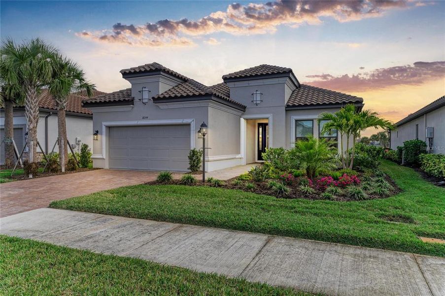 Front exterior of a new home in , Sarasota, FL, highlighting curb appeal (Image 2). Front exterior of a new home in , Sarasota, FL, highlighting curb appeal (Image 2).