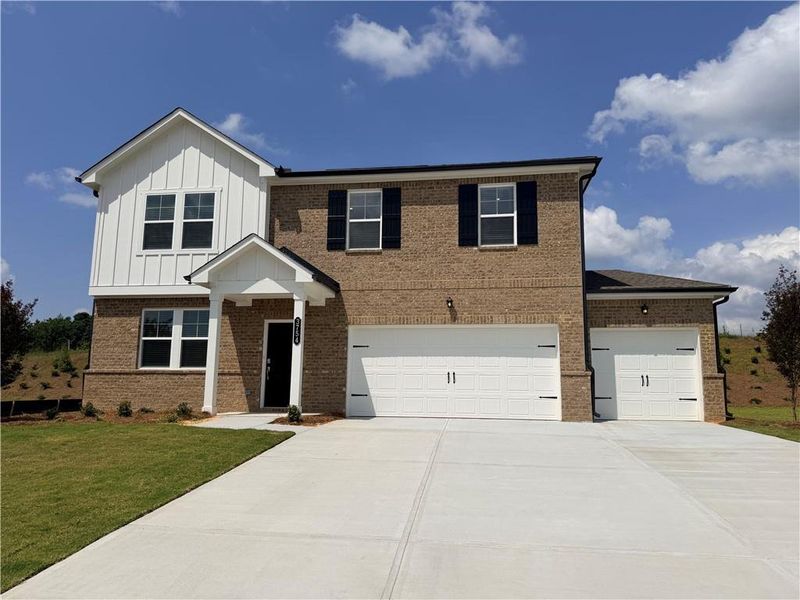 Front exterior of a new home in Apalachee Hills, Bethlehem, GA, highlighting curb appeal (Image 1). Front exterior of a new home in Apalachee Hills, Bethlehem, GA, highlighting curb appeal (Image 1).