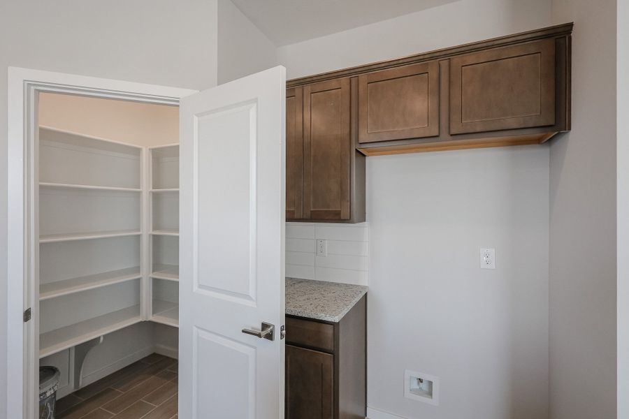 A kitchen with a white door.