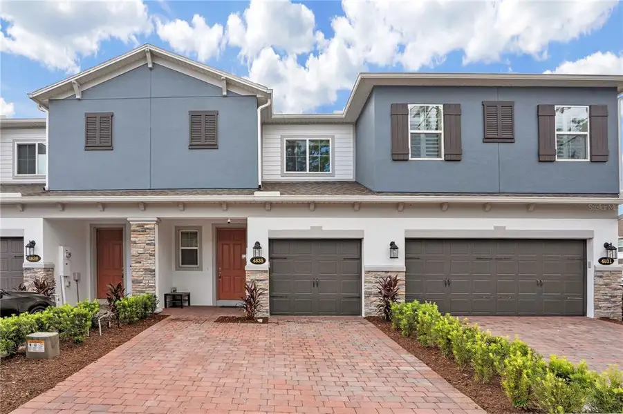 Front exterior of a new home in , Oviedo, FL, highlighting curb appeal (Image 26).