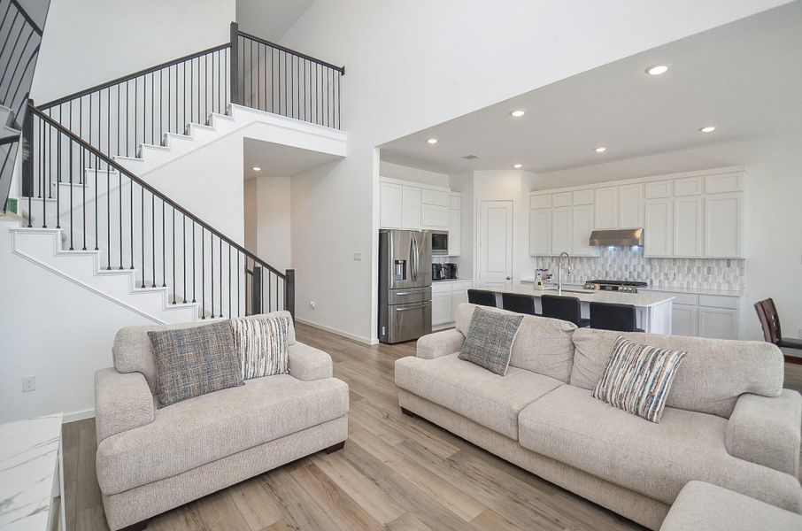 The kitchen, living and dining areas all come together as one beautiful unified place, perfect for daily living or entertaining.