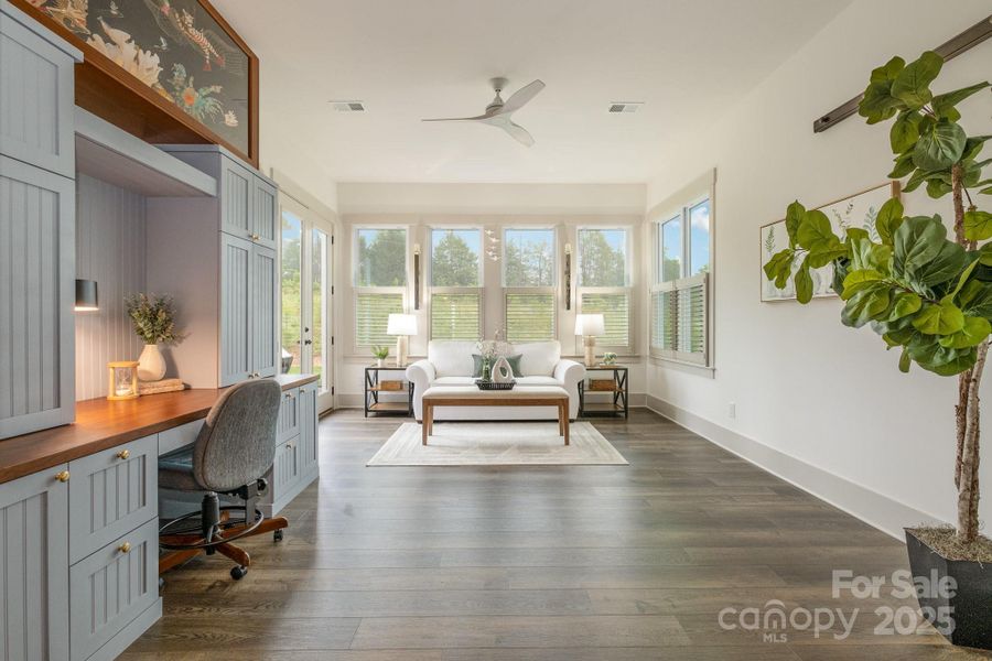 Large sunroom with a built-in cabinetry desk is the perfect place to spend the day Large sunroom with a built-in cabinetry desk is the perfect place to spend the day