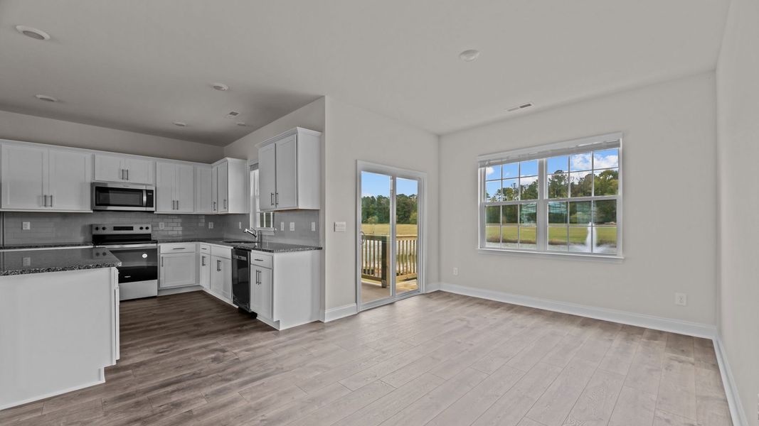Representative furnished interior of a home built from the Mills by D.R. Horton in Tyler - Home on the Lake, New Bern (Image 6).