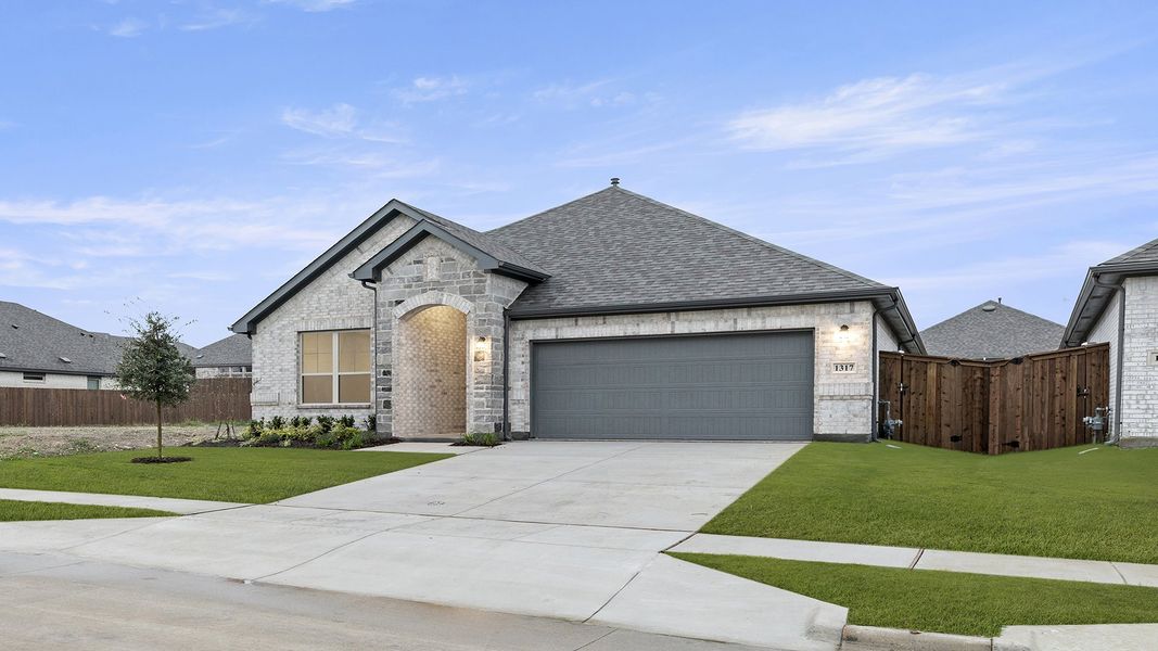 Front exterior of a new home in The Oaks, Red Oak, TX, highlighting curb appeal (Image 20). Front exterior of a new home in The Oaks, Red Oak, TX, highlighting curb appeal (Image 20).